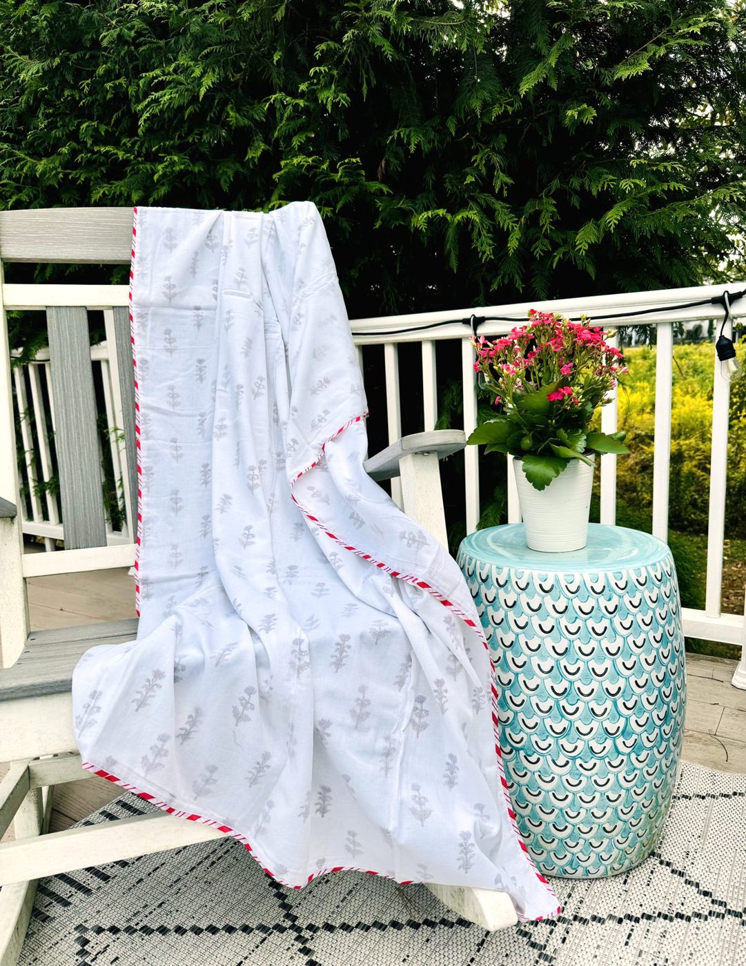 Mul cotton blanket draped over a garden chair