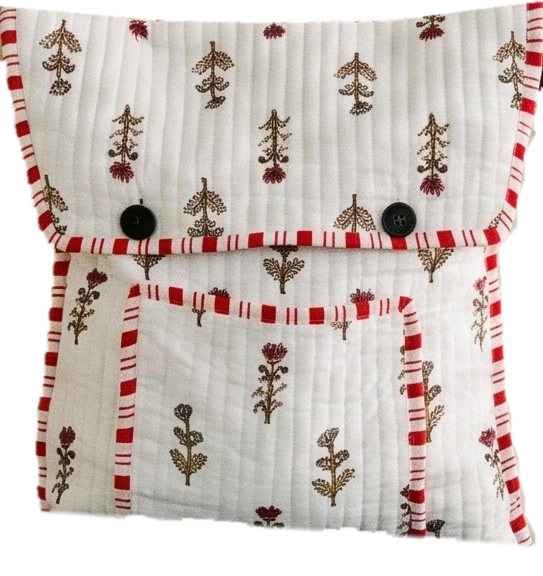 The large quilted pouch opening: toothpaste and toothbrush go into the toiletry pouch, then the toiletry pouch, tablet, blanket, passport and snacks go into the pouch and the earbuds into the front pocket
